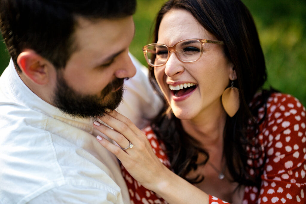 man and woman laugh together
