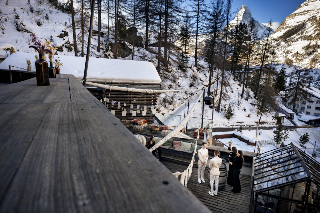 Matt and Brady exchanging vows in an intimate destination wedding ceremony at Cervo Resort in Zermatt, Switzerland surrounded by the stunning Swiss Alps