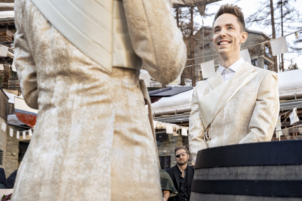 Matt and Brady exchanging vows in an intimate destination wedding ceremony at Cervo Resort in Zermatt, Switzerland surrounded by the stunning Swiss Alps