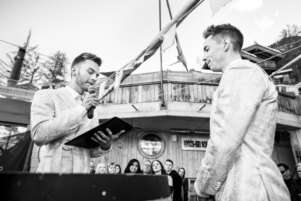 Matt and Brady exchanging vows in an intimate destination wedding ceremony at Cervo Resort in Zermatt, Switzerland surrounded by the stunning Swiss Alps