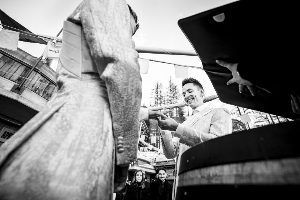 Matt and Brady exchanging vows in an intimate destination wedding ceremony at Cervo Resort in Zermatt, Switzerland surrounded by the stunning Swiss Alps