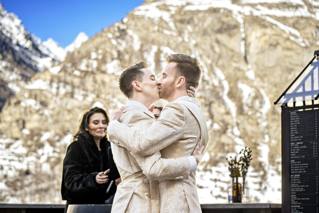 Matt and Brady exchanging vows in an intimate destination wedding ceremony at Cervo Resort in Zermatt, Switzerland surrounded by the stunning Swiss Alps