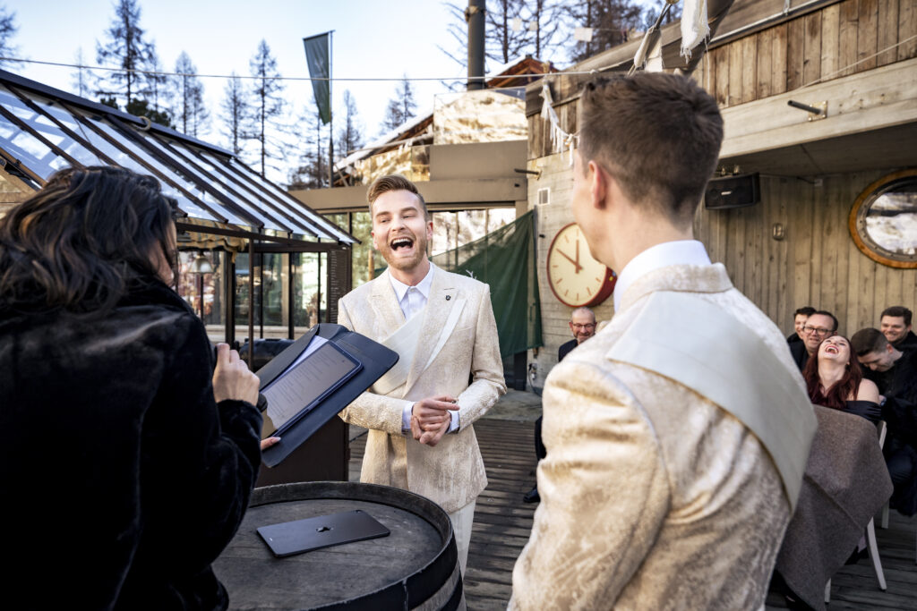Matt and Brady exchanging vows in an intimate destination wedding ceremony at Cervo Resort in Zermatt, Switzerland surrounded by the stunning Swiss Alps