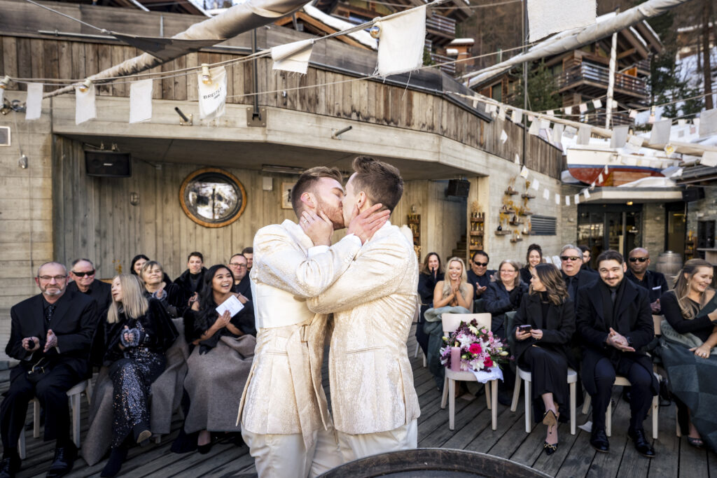 Matt and Brady exchanging vows in an intimate destination wedding ceremony at Cervo Resort in Zermatt, Switzerland surrounded by the stunning Swiss Alps