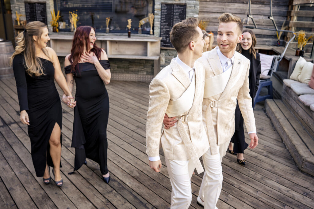Matt and Brady surrounded by friends at their Swiss Alps wedding reception at Cervo Resort in Zermatt, Switzerland
