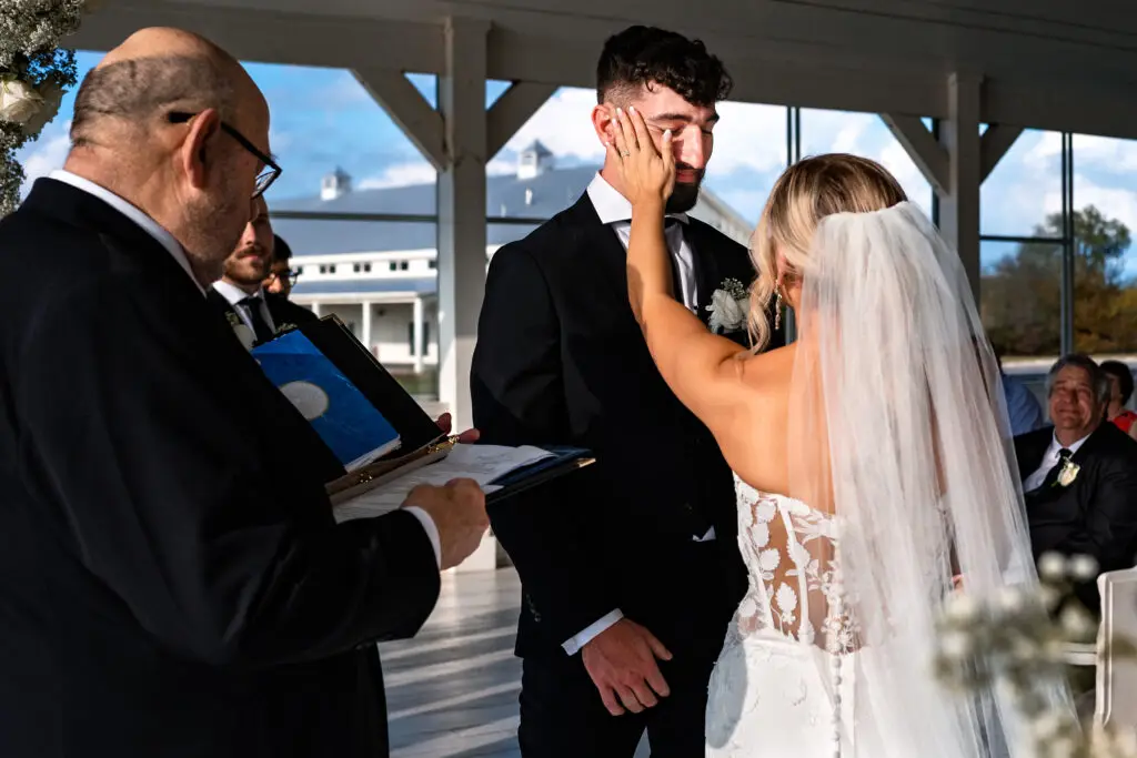 Candid Wedding Ceremony Moment at The Grand Ivory Wedding Venue in Leonard Texas by Dallas Documentary Wedding Photographers