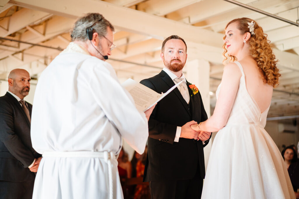 wedding ceremony at Brik Venue in Fort Worth by DFW Wedding Photographers The MacMeekens