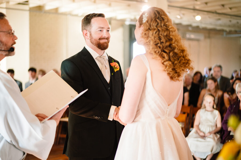 wedding ceremony at Brik Venue in Fort Worth by DFW Wedding Photographers The MacMeekens