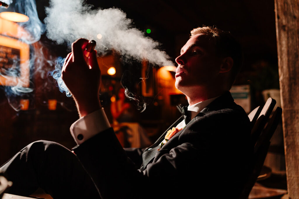 Cigar Roller During Wedding Reception at Avalon Legacy Ranch in Mckinney by DFW Wedding Photographers The MacMeekens