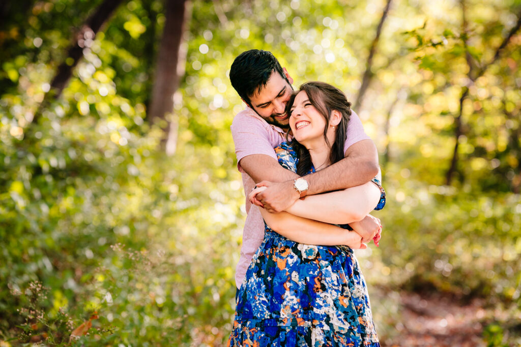 Close-up of Jen smiling as Azeem hugs her from behind during their DFW engagement photos.