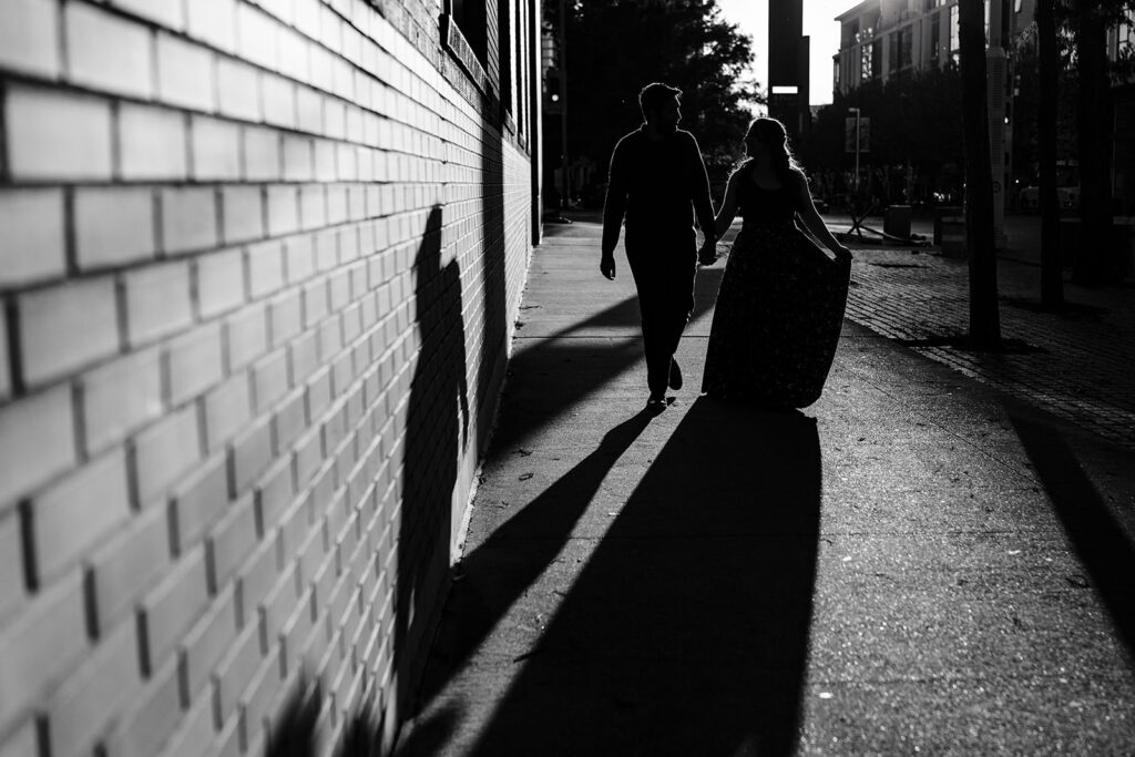 dramatic black and white shadow projection of couple during engagement session in downtown dallas