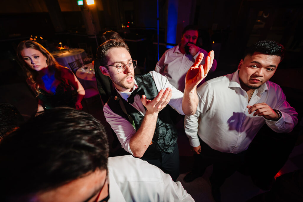 Wedding guests dancing during reception at The Carlisle Room in Dallas