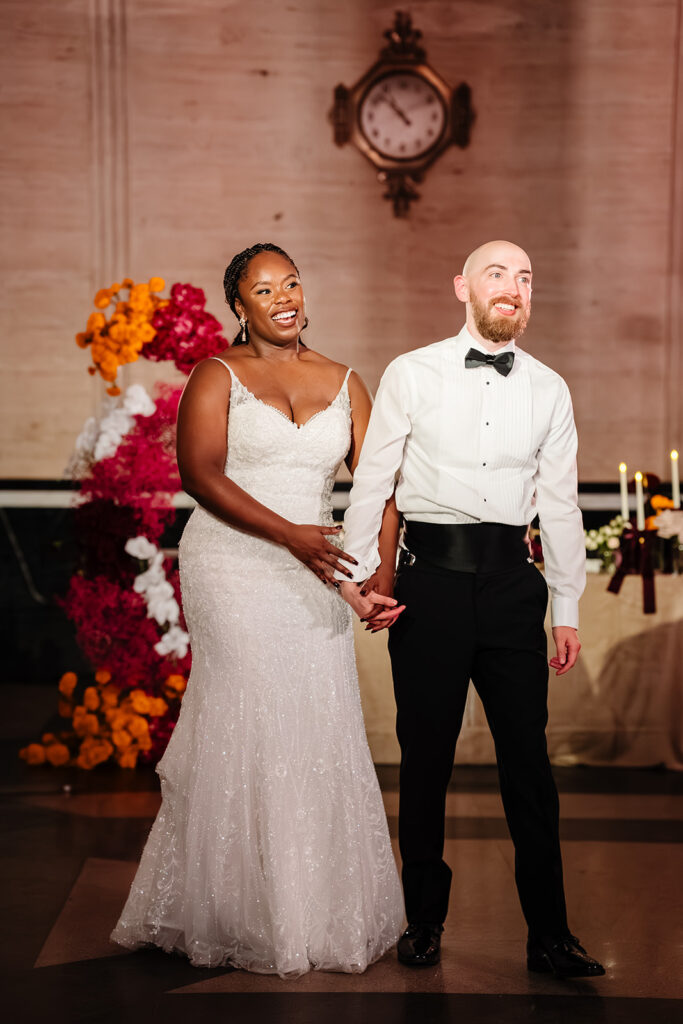 Bride and groom celebrating wedding reception with guests on the dance floor in Dallas at The Carlisle Room