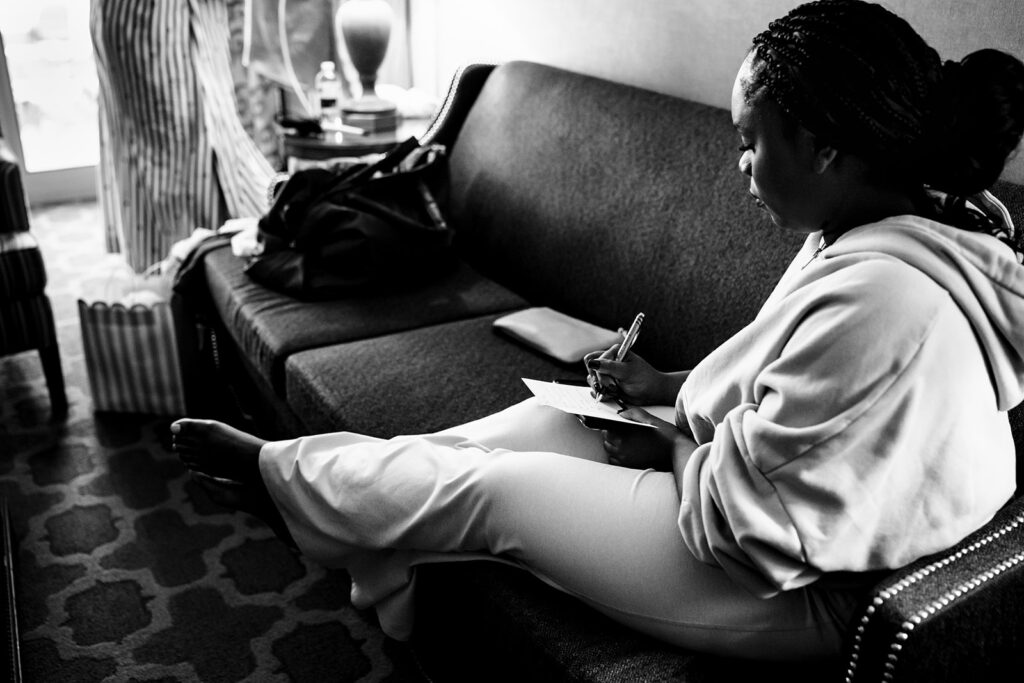 Bride getting ready with bridesmaids at The Fairmont Dallas on her North Texas wedding day