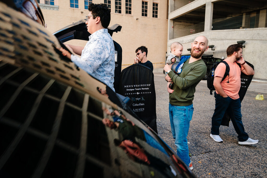 Candid groom getting ready moments before Dallas wedding ceremony at Tyler Street Church