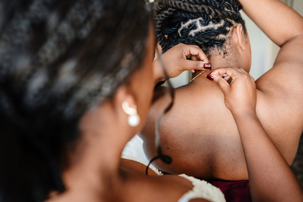 Bride getting ready with bridesmaids at The Fairmont Dallas on her North Texas wedding day