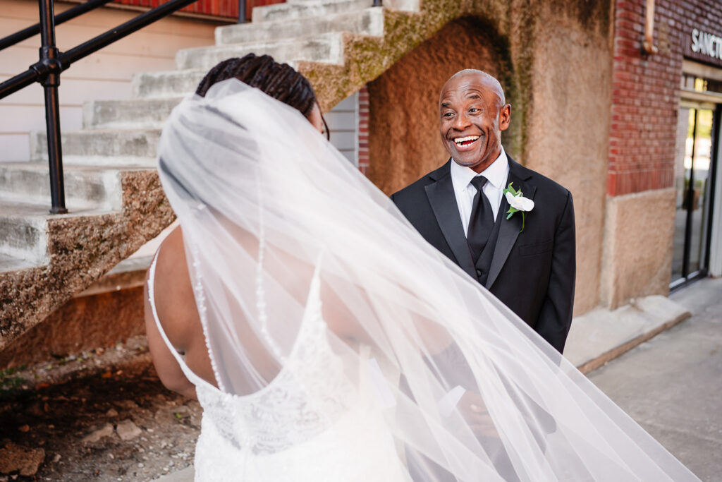 Bride’s first look with her dad before Tyler Street Church ceremony