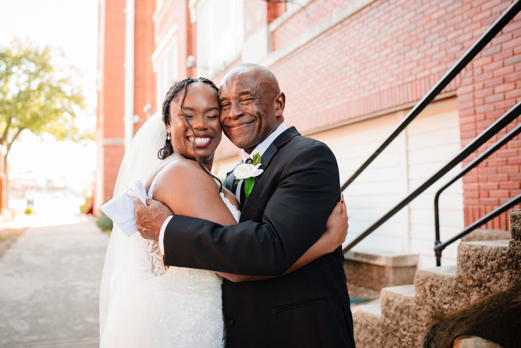 Bride and her father embracing during first look before ceremony