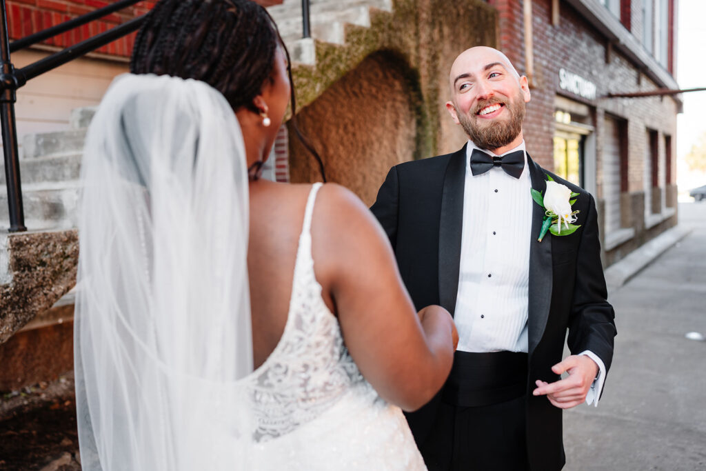 Emotional first look between Ashley and Tom on their Dallas wedding day