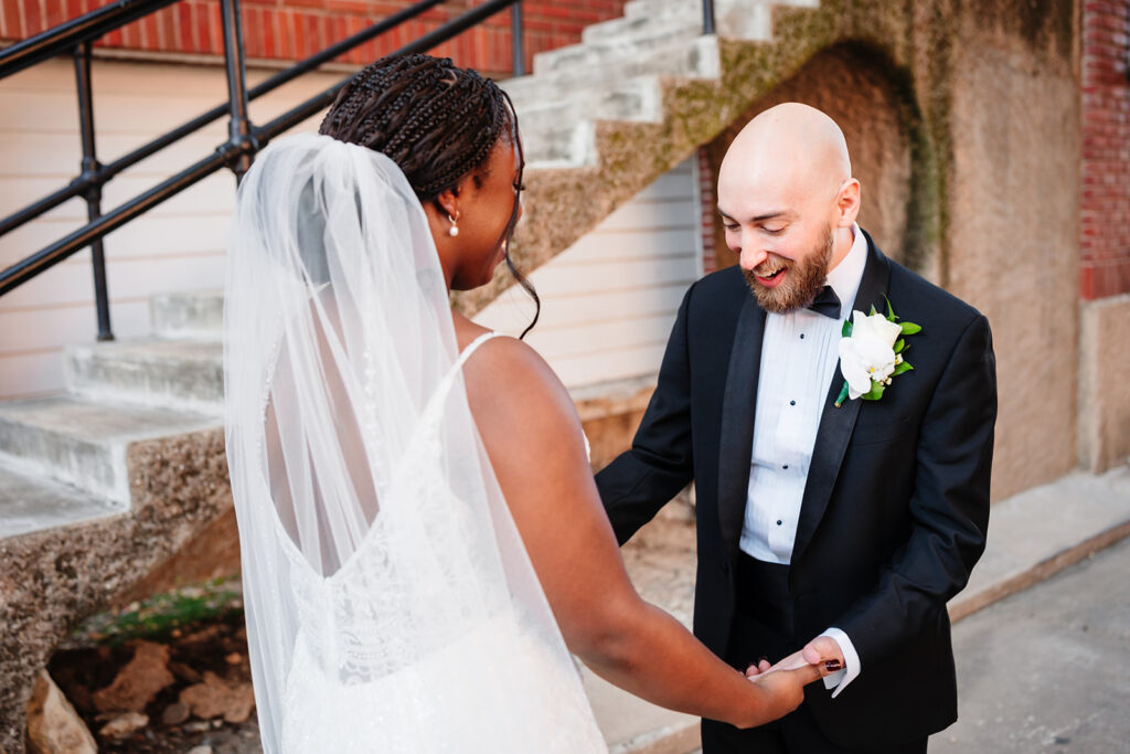 Joyful first look moment between bride and groom in Dallas