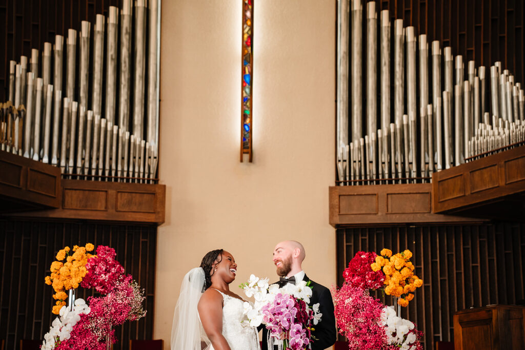 bride and groom waiting for wedding ceremony to begin at Tyler Street Church in Dallas, Texas