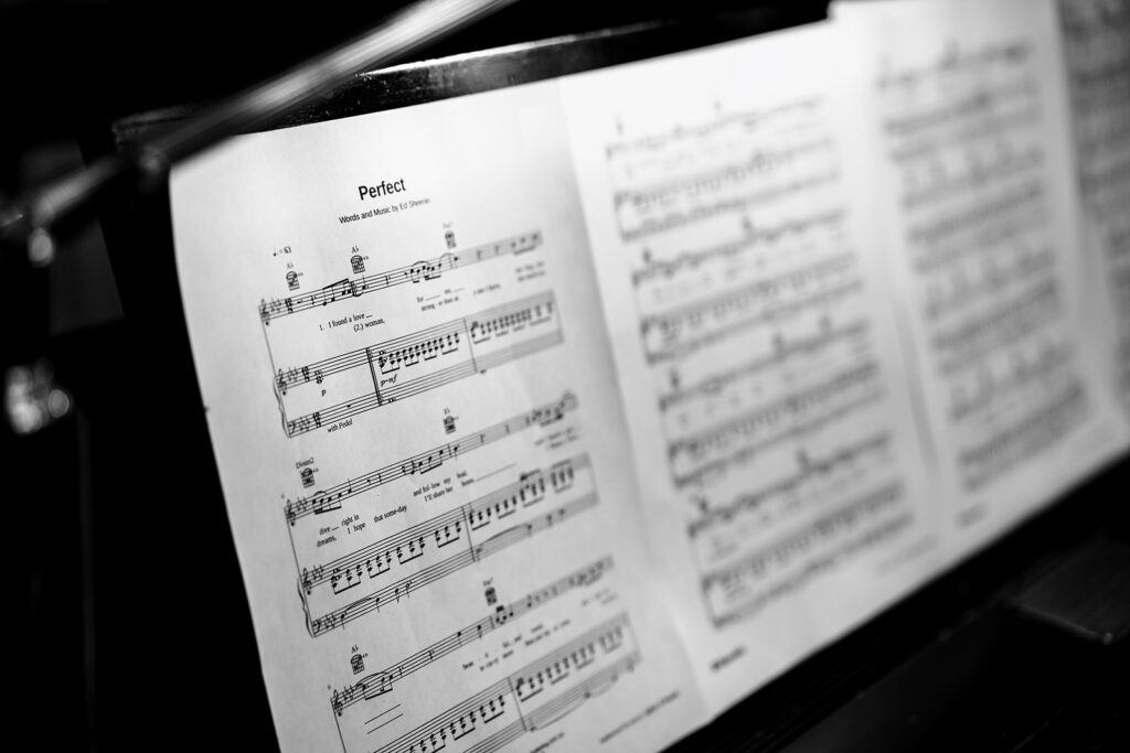 Musician plays piano during wedding ceremony at Tyler Street Church in Dallas