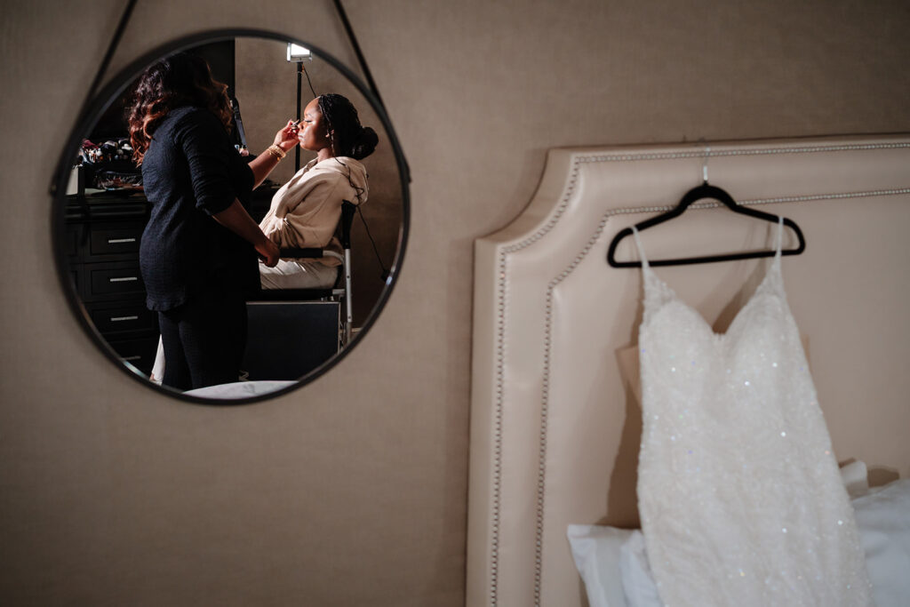 Bridal makeup being applied during wedding morning at The Fairmont Hotel Dallas