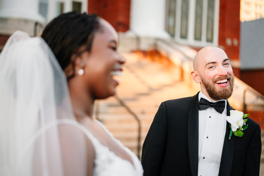 Fun couples portraits of Ashley and Tom on their Dallas wedding day at Tyler Street Church