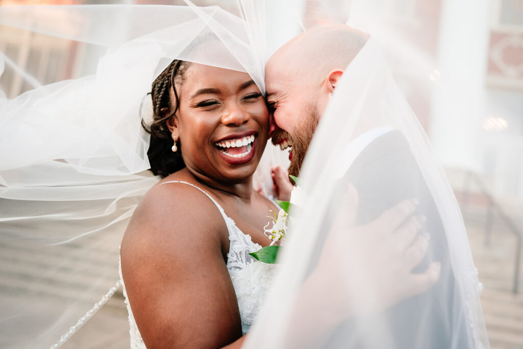 Fun couples portraits of Ashley and Tom on their Dallas wedding day at Tyler Street Church