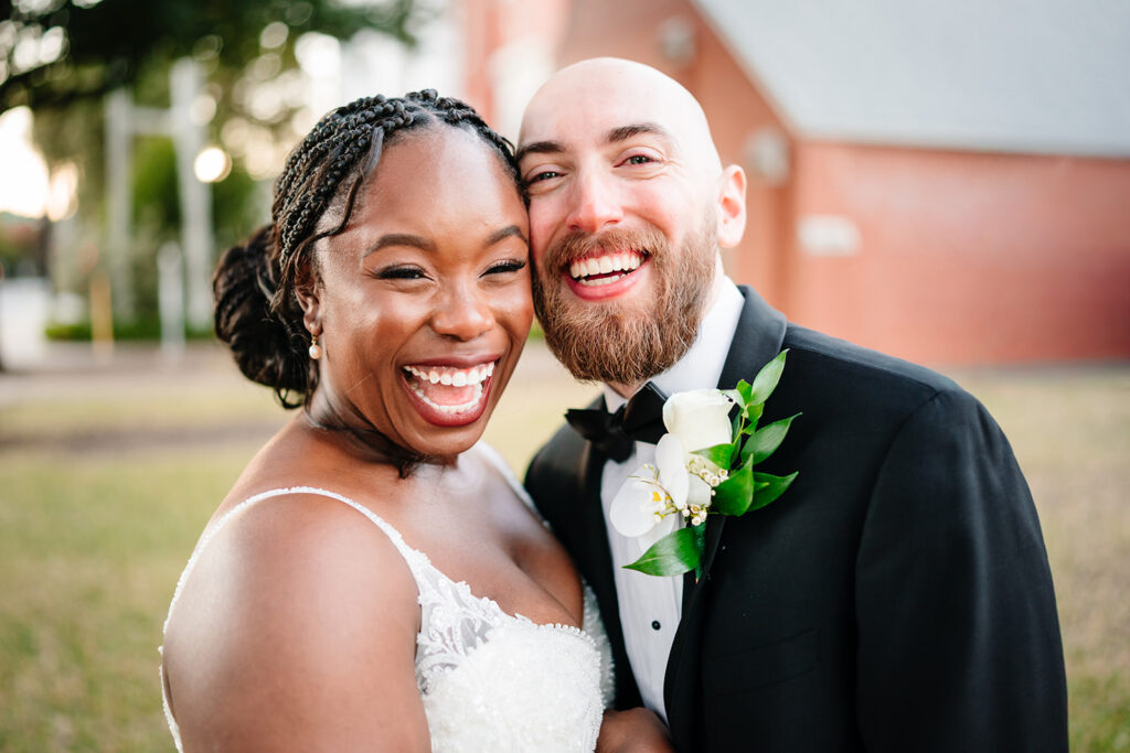 Joyfilled wedding portraits of bride and groom after wedding ceremony at Tyler Street Church in Dallas