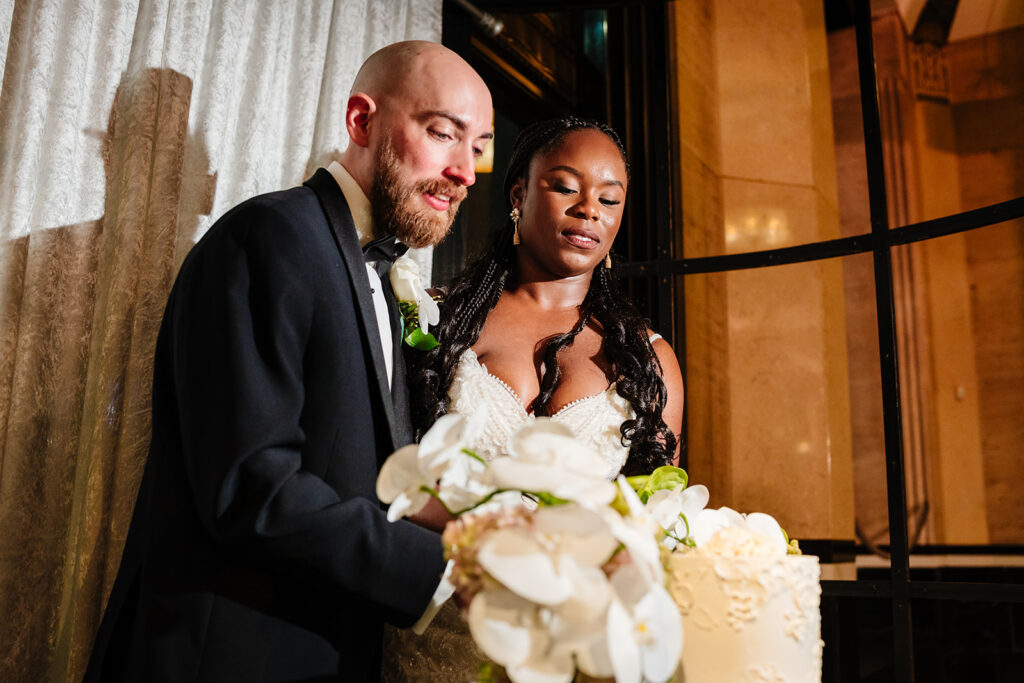 Cake cutting during wedding reception at The Carlisle Room in Dallas with