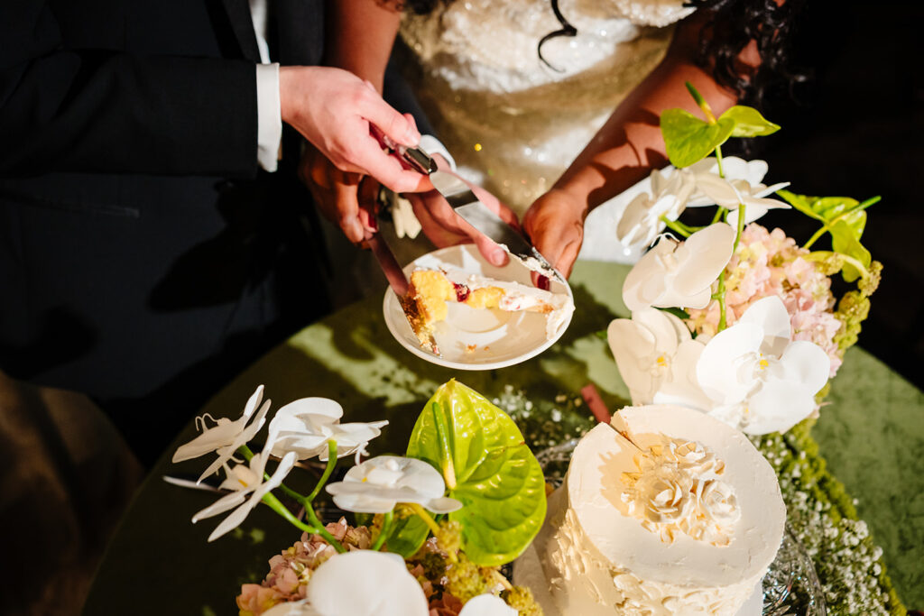 Cake cutting during wedding reception at The Carlisle Room in Dallas with