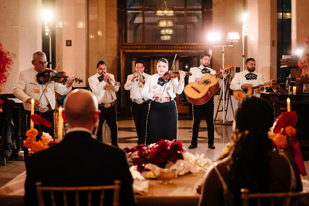 Mariachi band playing during cultural fusion wedding reception at The Carlisle Room in Dallas