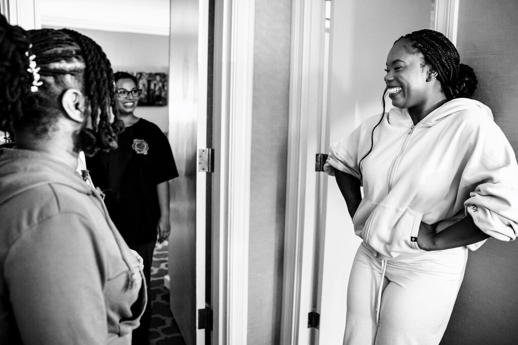Bride getting ready with bridesmaids at The Fairmont Dallas on her North Texas wedding day