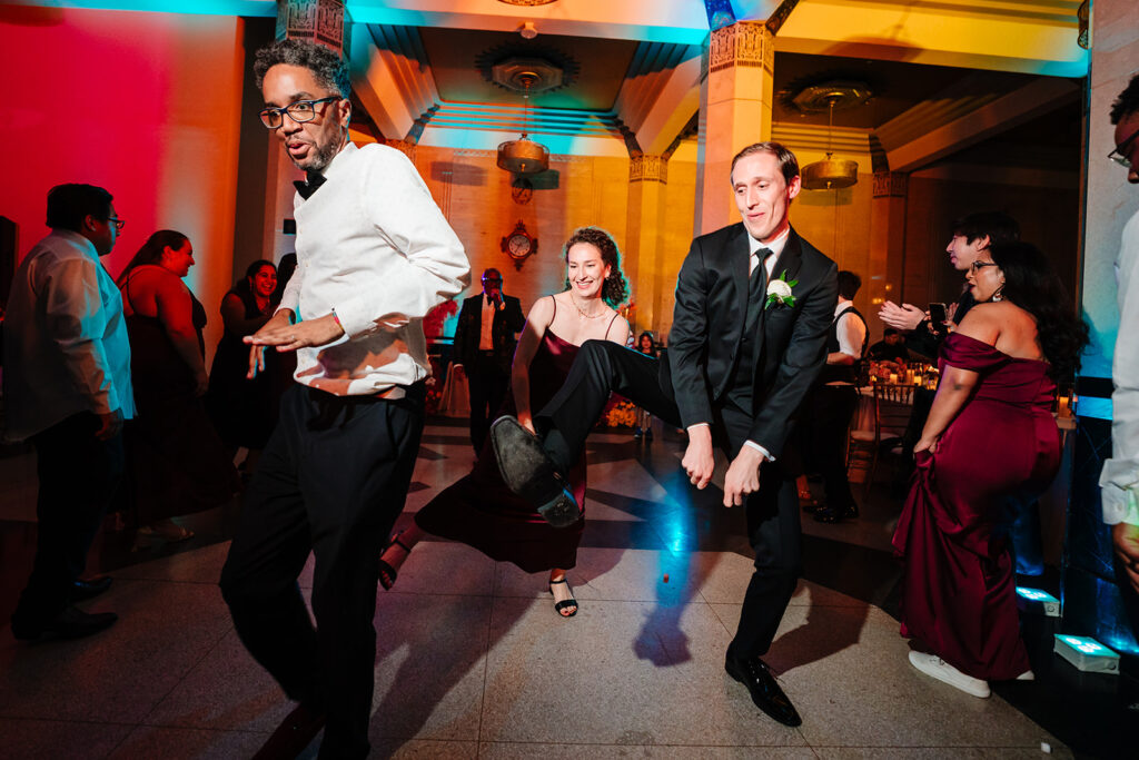 Wedding guests dancing during reception at The Carlisle Room in Dallas
