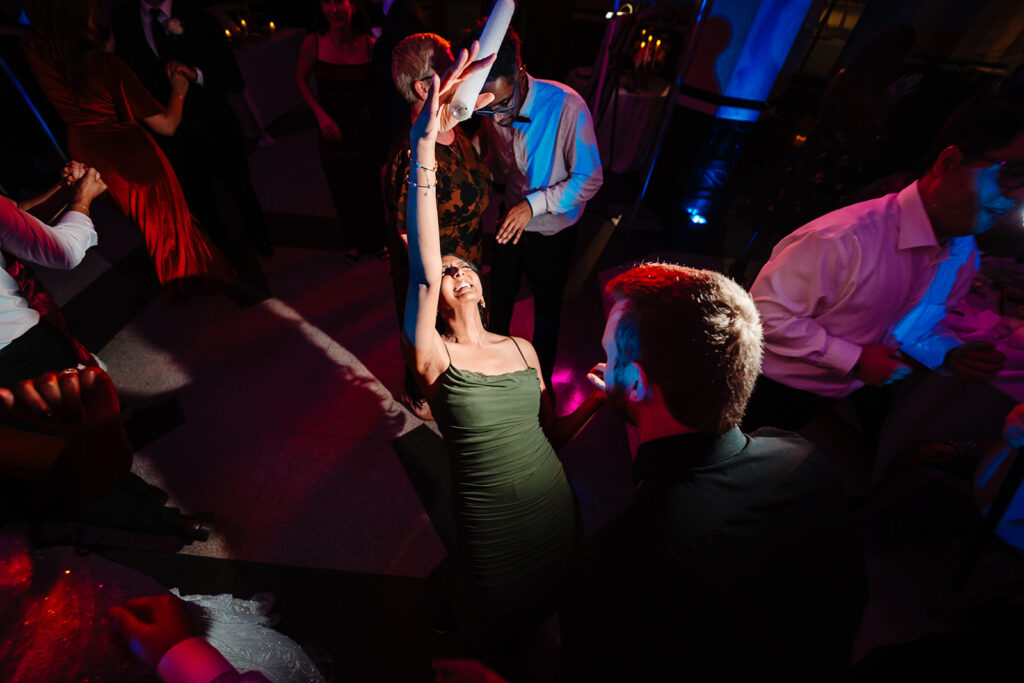 Wedding guests dancing during reception at The Carlisle Room in Dallas