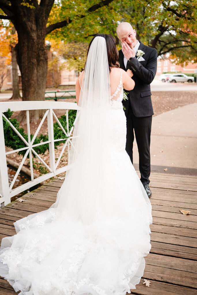 April and Nate sharing their first look before their Plano wedding