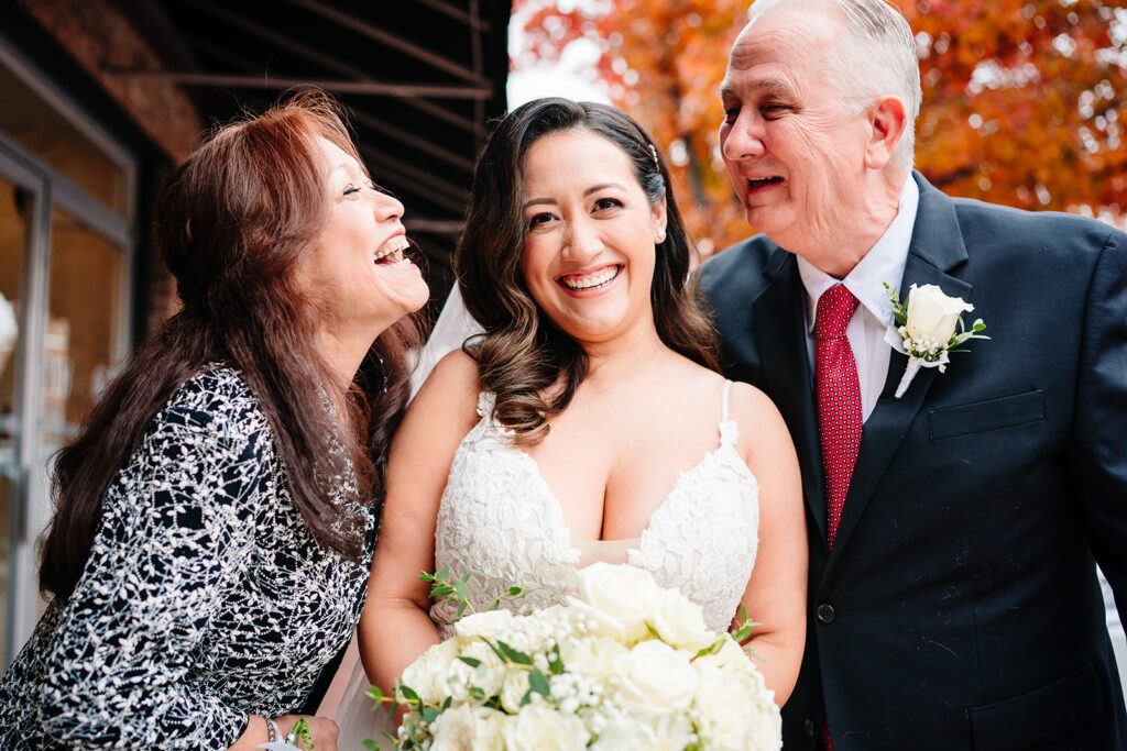 Bride sharing a first look with her parents before the ceremony