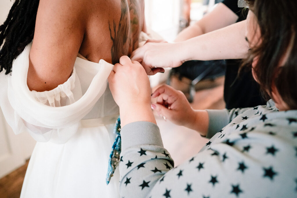 Andrea getting ready for wedding at HIstoric Frankford Chapel in Dallas by autism friendly wedding photographers the macmeekens
