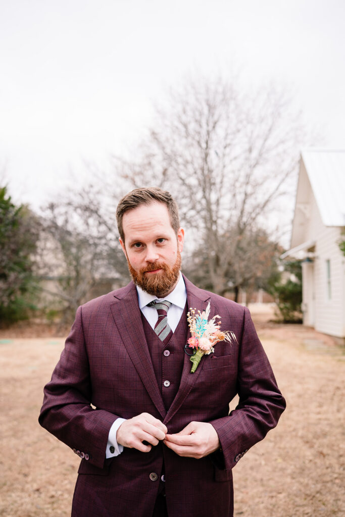Josh getting ready for wedding at Historic Frankford Chapel in Dallas by autism friendly wedding photographers the macmeekens