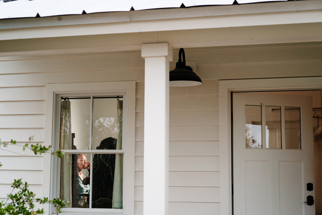Andrea getting ready for wedding at HIstoric Frankford Chapel in Dallas by autism friendly wedding photographers the macmeekens