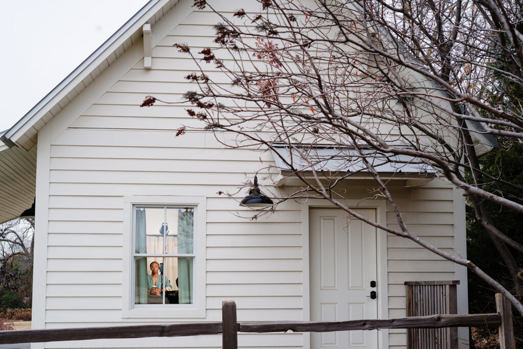 Andrea getting ready for wedding at HIstoric Frankford Chapel in Dallas by autism friendly wedding photographers the macmeekens