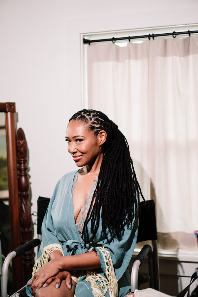 Andrea getting ready for wedding at HIstoric Frankford Chapel in Dallas by autism friendly wedding photographers the macmeekens
