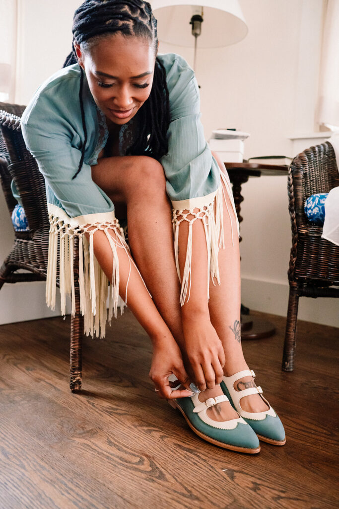 Andrea getting ready for wedding at HIstoric Frankford Chapel in Dallas by autism friendly wedding photographers the macmeekens