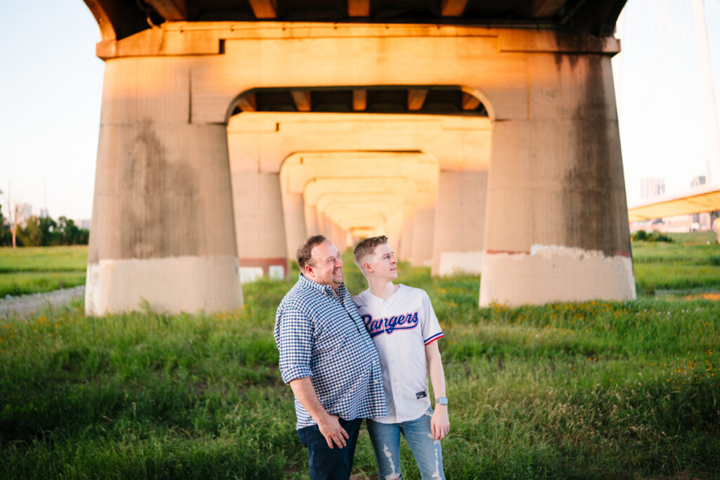 Queer Dallas Engagement Session with Cinematic Skyline Views at Margaret Hunt Hill Bridge