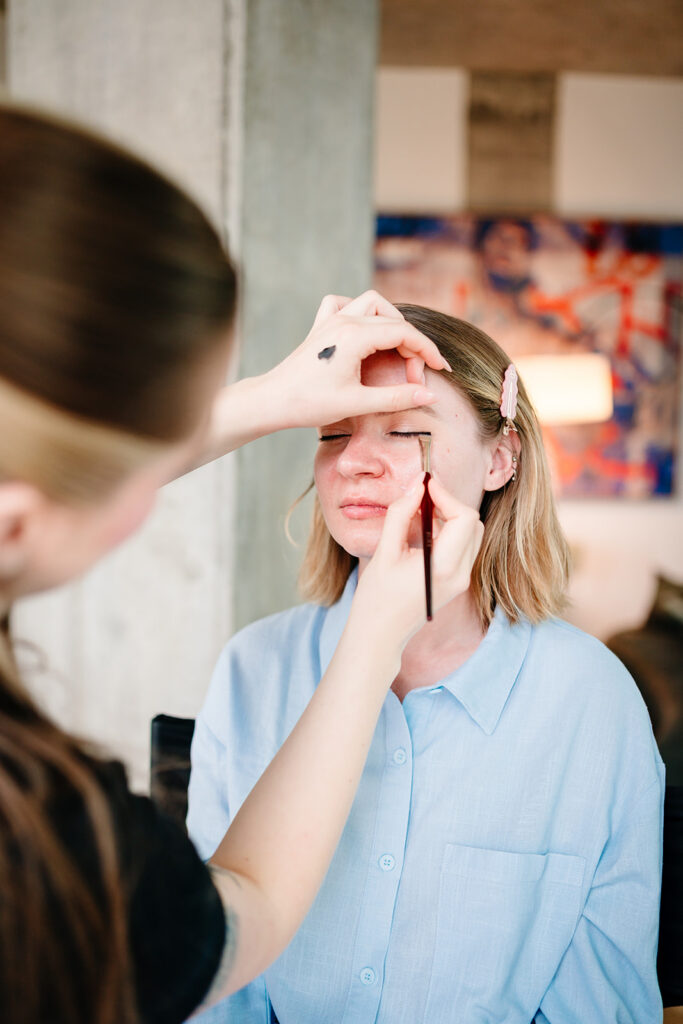 Bride getting ready for North Texas LGBTQ Wedding at The Filter Building on White Rock Lake by Dallas Inclusive Wedding Photographers