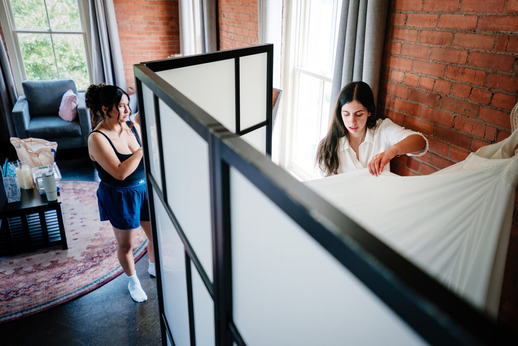 Bride getting ready for North Texas LGBTQ Wedding at The Filter Building on White Rock Lake by Dallas Inclusive Wedding Photographers