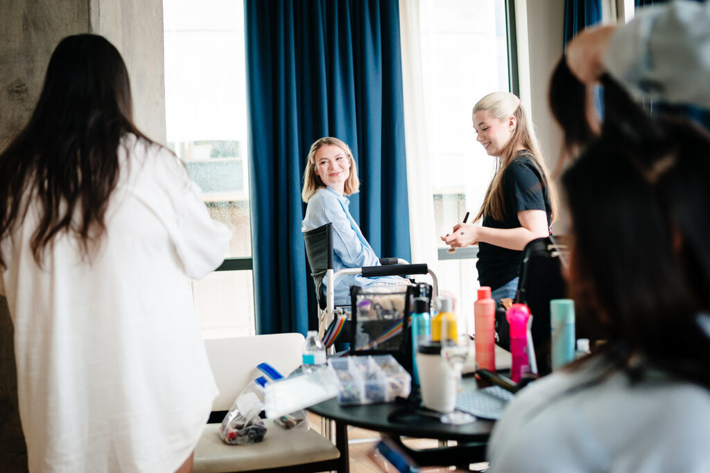 Bride getting ready for North Texas LGBTQ Wedding at The Filter Building on White Rock Lake by Dallas Inclusive Wedding Photographers