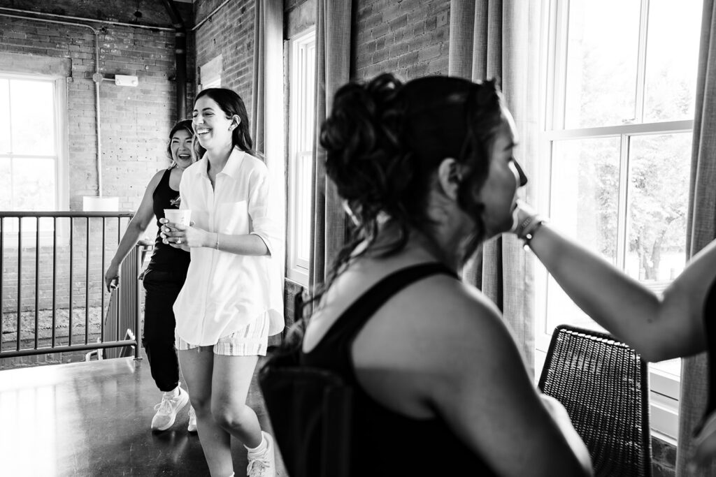 Bride getting ready for North Texas LGBTQ Wedding at The Filter Building on White Rock Lake by Dallas Inclusive Wedding Photographers