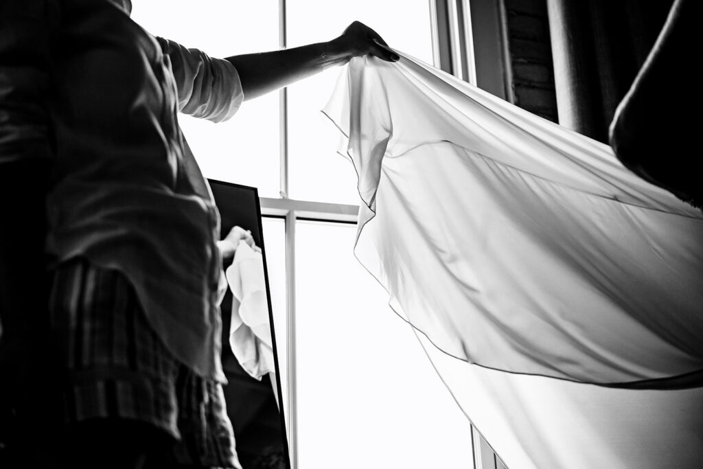 Bride getting ready for North Texas LGBTQ Wedding at The Filter Building on White Rock Lake by Dallas Inclusive Wedding Photographers
